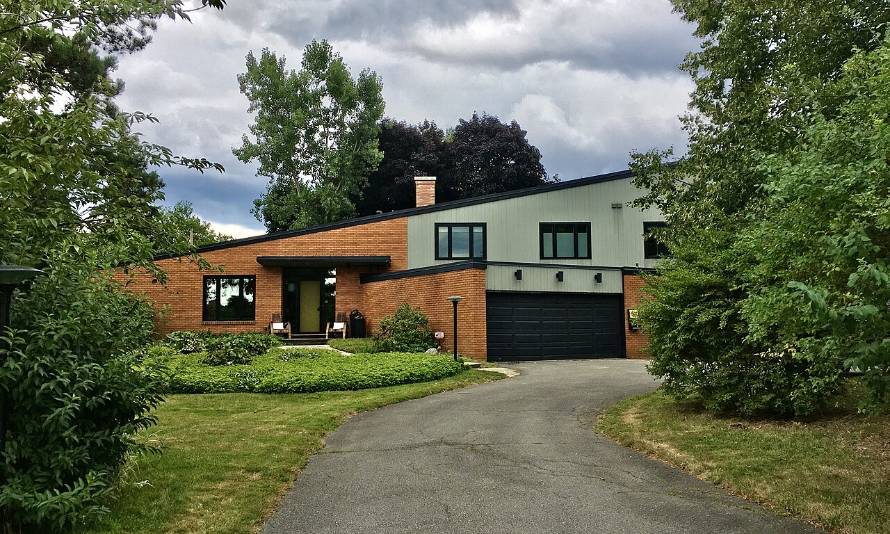 Same house exterior on a dull overcast day
